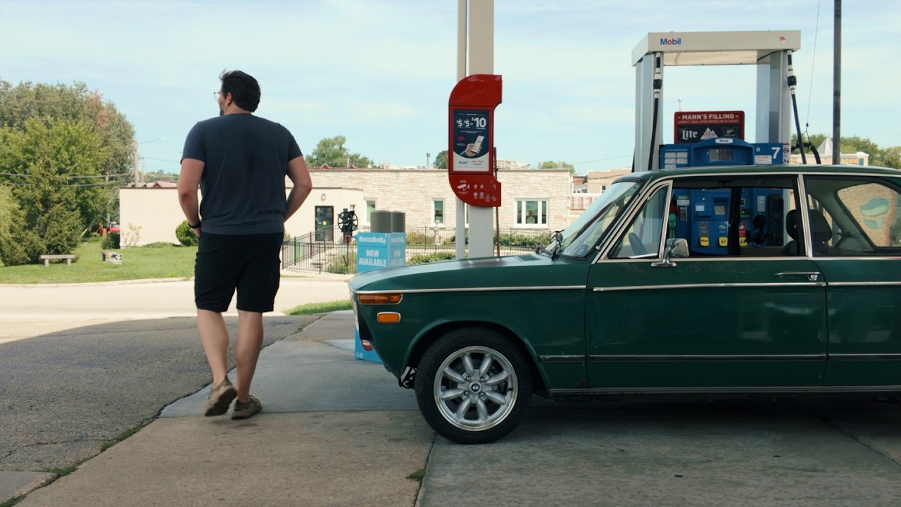 Drive, Revive, Tinker episode featuring a vintage green BMW at a gas station